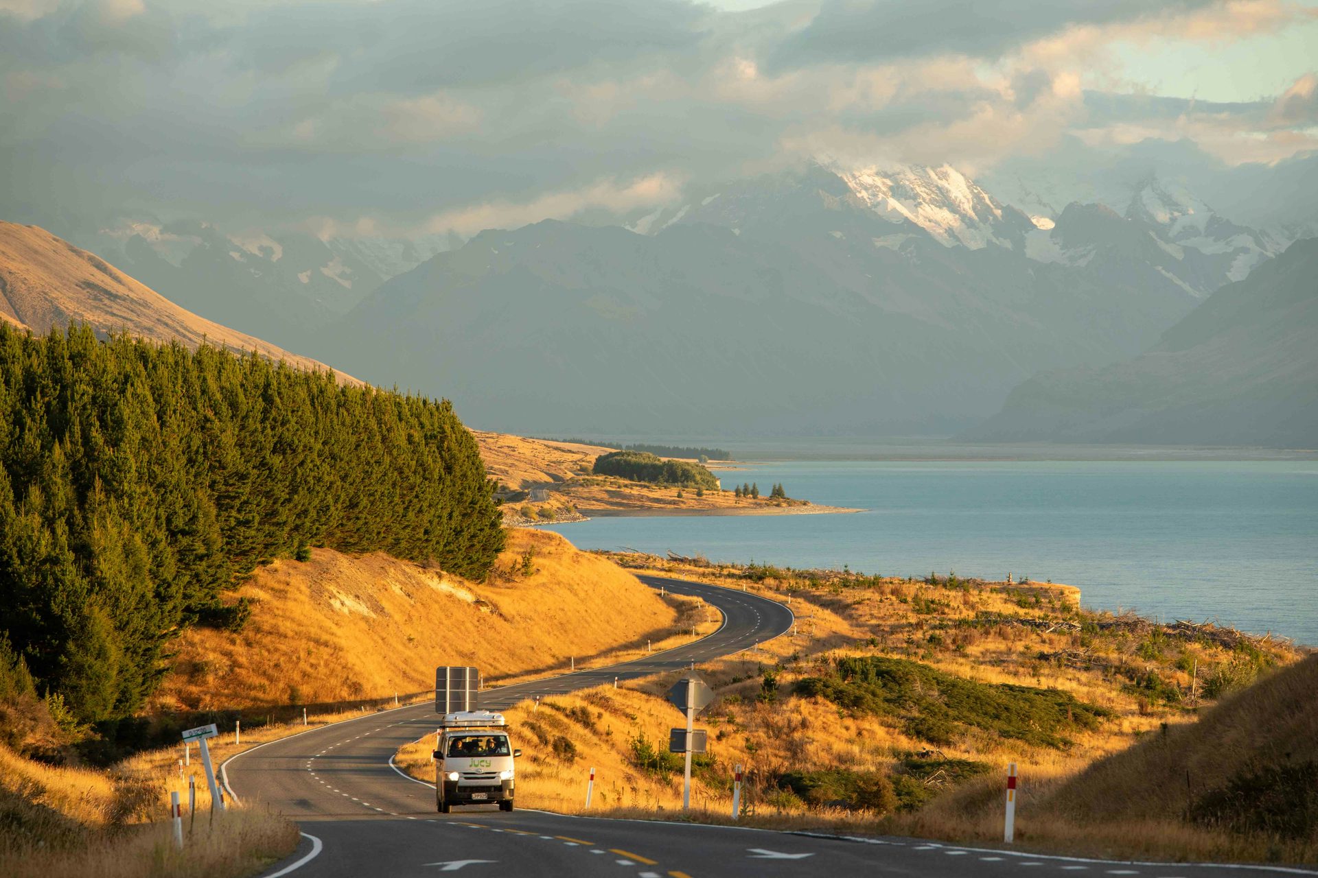 A van on a scenic open road